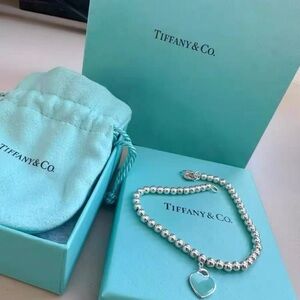 Tiffany & Co. Silver Bead Bracelet with Blue Heart Charm